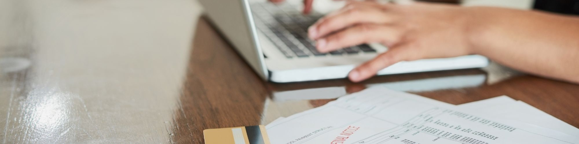 Person on computer with overdue final notice